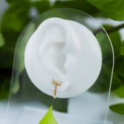 Tytanowy złoty labret z zwisającą cyrkonią