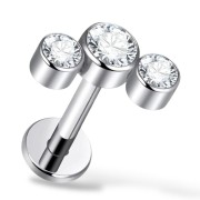 Tytanowy labret z trzema cyrkoniami.